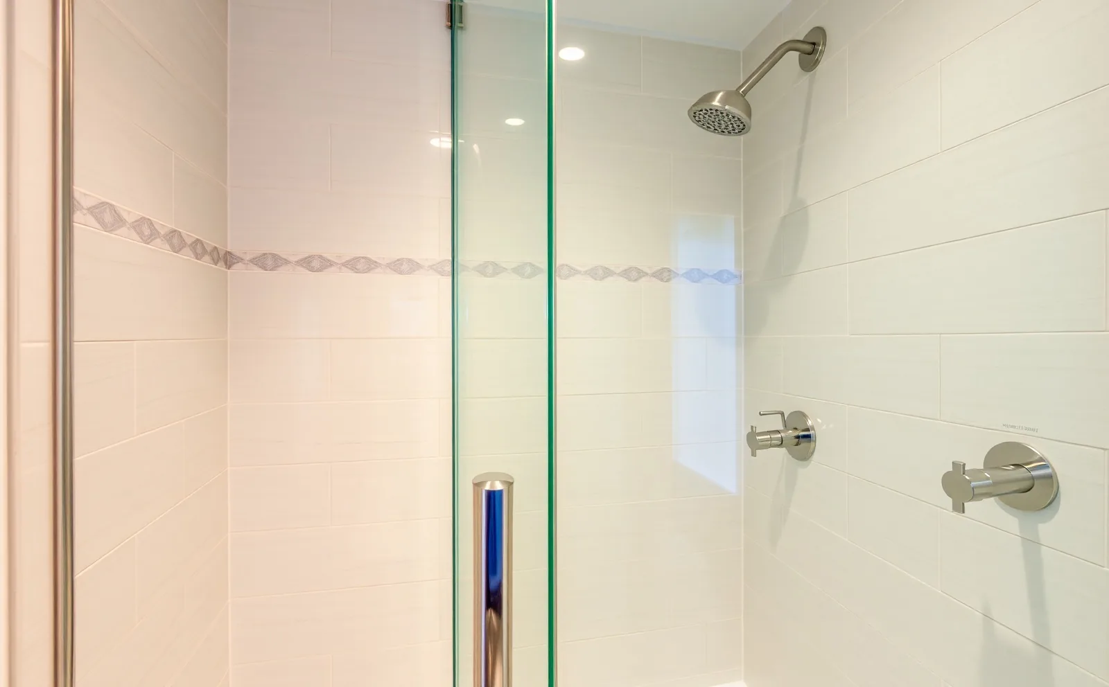 Frameless glass and linear drains — built for Cutler Bay Haven bathrooms in Cutler Bay, FL — Schluter waterproofing membrane applied to shower walls before tiling