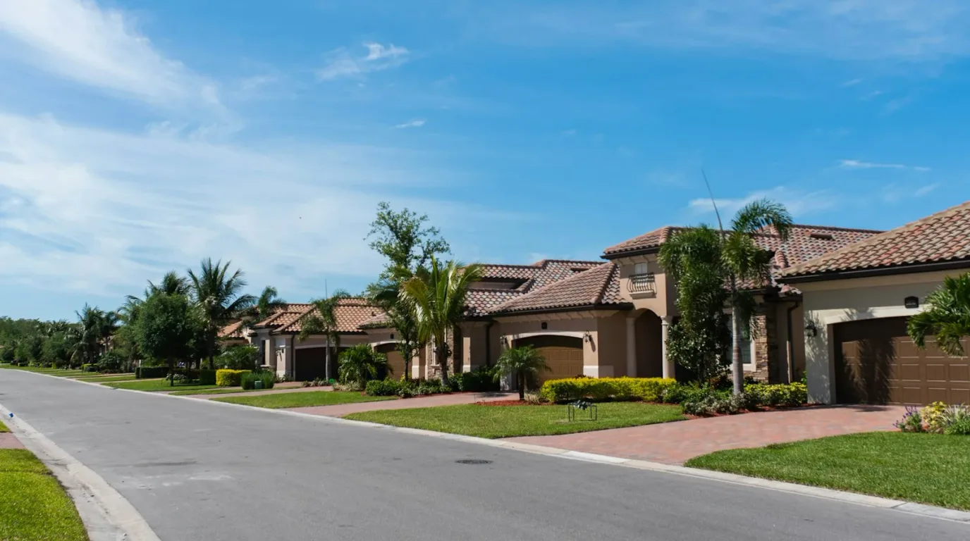 South Florida neighborhood of homes with tile roofs and palm trees